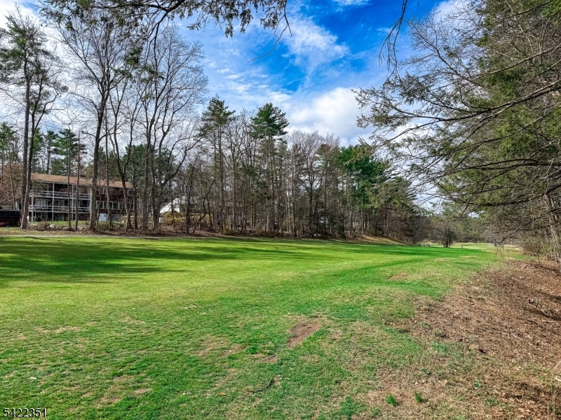 Spacious second-floor unit located in the High Point Country Club community, backing directly to the golf course for peaceful, scenic views. This 3-bedroom, 2 full bath condo offers a functional layout, including a primary bedroom with ensuite bath and in-unit laundry. The home does require some TLC and presents a great opportunity to update and make it your own. Features include a newer hot water heater and a roof replaced within the last 5 years. Enjoy a private setting with no rear neighbors along with all that High Point Country Club has to offer, including community amenities and a convenient location close to New York and Pennsylvania.