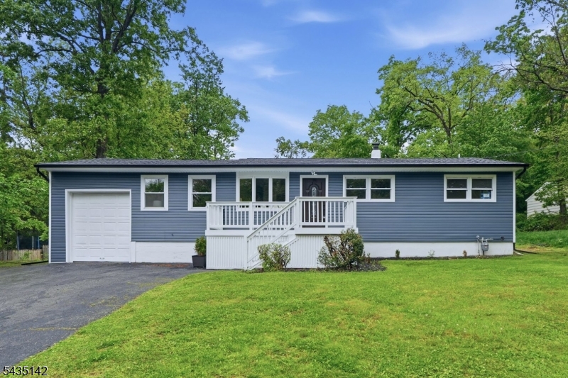 Welcome to this beautifully renovated ranch in desirable Hopatcong Heights, where modern finishes and easy one-floor living come together perfectly. Step inside to a bright, open layout filled with natural light, recessed lighting, and waterproof LVP luxury vinyl plank flooring throughout. The stunning kitchen is the heart of the home, featuring quartz countertops, a matching quartz backsplash, crisp white cabinetry, and a separate dining area perfect for everyday living or entertaining. Offering 3 bedrooms and 2 full bathrooms with sleek stall showers, the home delivers both comfort and functionality. Enjoy outdoor living on the spacious deck overlooking the backyard, along with the convenience of an attached 1-car garage, additional parking, and an unfinished basement offering plenty of storage or future potential. Major upgrades provide true peace of mind, including a brand-new septic system, new HVAC system, new water heater, new roof, new siding, and natural gas. Move-in ready and thoughtfully updated throughout, this is a fantastic opportunity to own a fully renovated home in one of Hopatcong's most sought-after neighborhoods.
