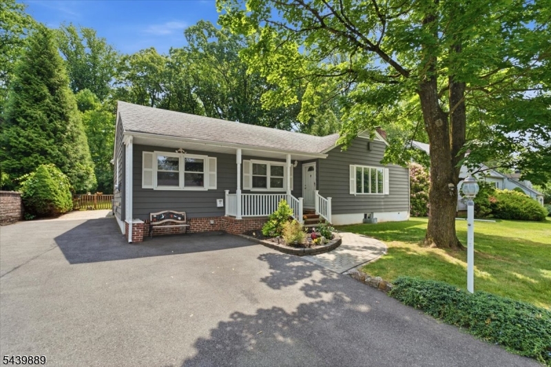 Situated on a beautiful quiet block with a true neighborhood feel, this ranch sits on a deep lot with room for everything outdoor living has to offer. Inside the flow is just right. You move naturally from the formal living room into the dining room, into the updated kitchen, and out into a huge sunlit family room wrapped in windows and doors on all sides. The light in this room alone will stop you in your tracks. It is the kind of space that makes you want to pour a coffee and just sit for a while. Two bedrooms and a full bath round out the main level. Downstairs surprises you. A finished basement with more space than you would expect offering a rec room, a bonus room that flexes as a bedroom, office, or playroom, a full bath, laundry, and storage. The kind of space that grows with you. Out back maintenance free composite decking stretches the entire back of the home with multiple patio areas. No rear neighbors. Mature landscaping wrapping the perimeter and wooded views that make this backyard feel less like a yard and more like a private retreat. And there is plenty of land here for future expansion if the vision ever calls for it.  Whether you are starting out or settling in, this one is special. Come see for yourself.