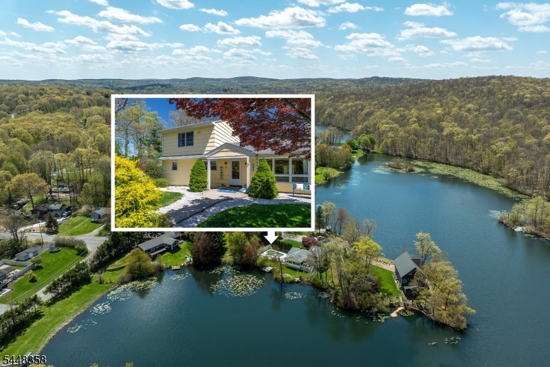 Peninsula Haven - Welcome to lakefront living in Barry Lakes, a private Vernon Township lake community surrounded by natural beauty and year-round recreation. Set on a low-traffic cul-de-sac peninsula with 228 feet of lake frontage, this TRUE 5-bedroom, 2-bath home offers privacy, expansive water views, an inground pool, and two docks for easy lake access. A fenced front yard with mature privacy hedges leads to a covered entry and welcoming foyer. Inside, the living room centers around a charming brick fireplace before flowing into the dining area and kitchen. Toward the rear of the home, a bright vaulted sunroom wrapped in warm wood walls, skylights, and walls of windows captures sweeping 180-degree lake views and opens directly to the newer deck and pool area an ideal setting for quiet mornings, summer gatherings, and sunset evenings by the water. The main level includes three bedrooms, a full bath, mudroom, and an additional full bathroom, while the upper level offers two generous bedrooms with vaulted ceilings. Outside, enjoy off-street parking, a pool shed, lakefront lawn space, and the peaceful feel of a true retreat. Recent updates include a newer roof, 2021 deck, 2026 pool pump, water heater May 2025, and septic inspected and serviced in 2026. Barry Lakes offers lakes, beaches, clubhouse, playground, ball field, basketball court, and community-maintained roads, with Wawayanda State Park, the Appalachian Trail, Crystal Springs Resort, and Warwick, NY nearby.