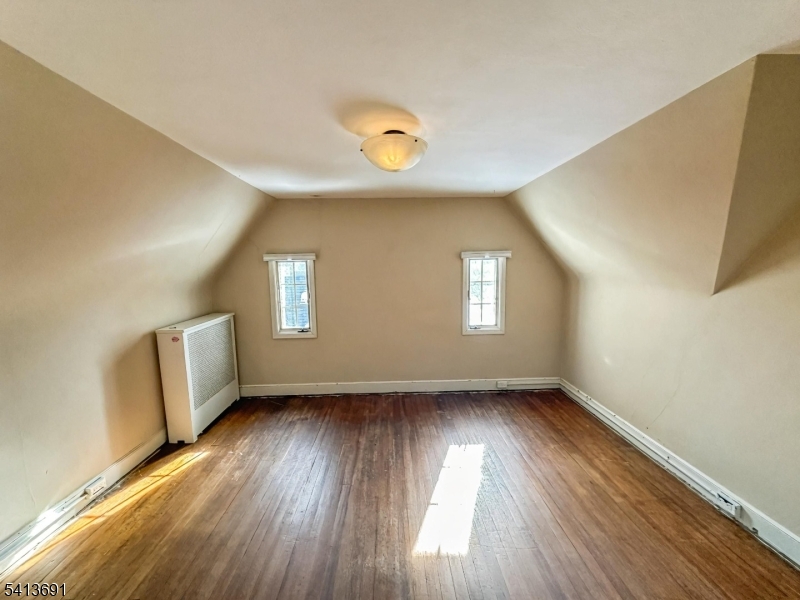 Welcome to this spacious Tudor-style Colonial located in the desirable borough of Glen Rock. Situated on an approximately 0.39-acre corner lot, this classic home offers over 3,500 square feet of living space and timeless architectural charm. The property features 6 bedrooms, multiple bathrooms, and generous living areas designed for comfortable everyday living and entertaining. Built in 1923, the home offers a traditional layout with large rooms, hardwood flooring, and plenty of natural light throughout. Additional highlights include a finished basement with ground-level access, fireplace, attached garage, and a deck/patio overlooking the property. Conveniently located near local parks, schools, shopping, and transportation options, this property offers a great opportunity to own a classic home in one of Bergen County's most sought-after communities. With its spacious layout and prime location, this home presents endless potential for customization and modernization.