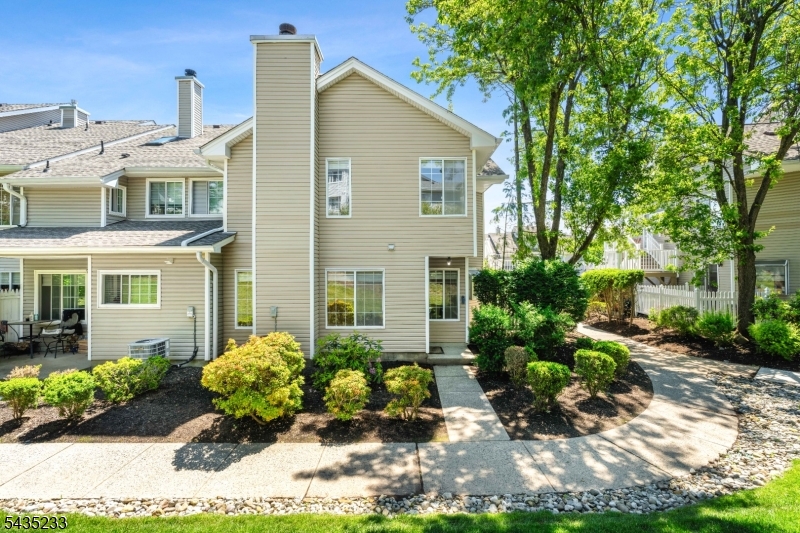 Bright and beautifully maintained end-unit townhouse in the desirable Signal Point community in the Hills section of Bedminster. Filled with natural light, this inviting home features a warm wood-burning fireplace, a cozy living area, and a private patio overlooking a peaceful wooded setting. Both bedrooms feature private baths and closet organizers, providing comfort and convenience. The thoughtful layout offers comfortable everyday living with an airy feel throughout. Ideally located just minutes from shopping, dining, entertainment, and major commuter routes including Routes 22, 287, 78, 202, and 206. Enjoy easy access to Bridgewater Commons Mall, as well as train and bus service to NYC.