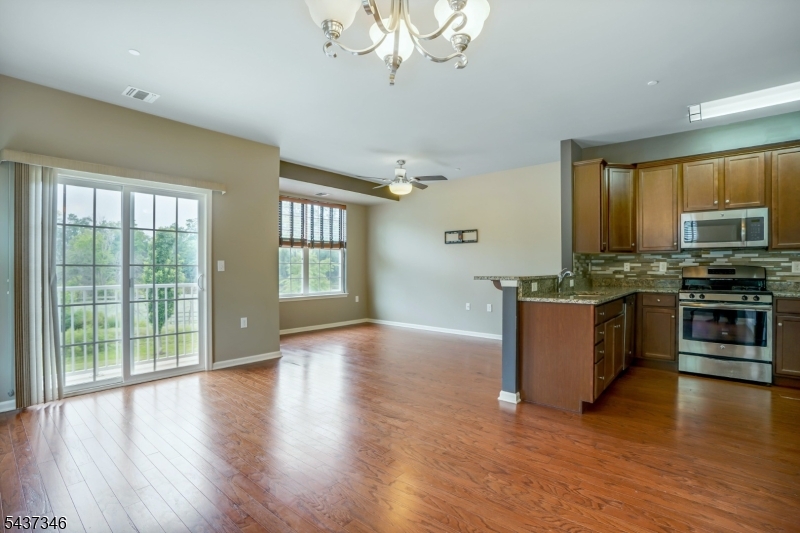 Available NOW! Minimum 1-yr lease. Landlord may accept 1 small dog under 30 lbs for add'l $75/month rent. Tenant pays first $100 of any repair. Application, proof of income, NTN report required. Tenants must purchase renter's insurance. Newer luxurious private end unit in a premium location with lovely views of the pond! Backs to trees for extra privacy. Stylish, open, & bright with Wood Floors, 2 Balconies, large Bedrooms, and a Kitchen with granite counters. Two story entry leads to open Living and Dining Rooms, perfect for entertaining. The Kitchen features a breakfast bar and stainless steel appliances. Convenient main level Powder Room. Third floor offers three spacious Bedrooms, including a Primary Suite that boasts its own private balcony and dual sinks in the en suite Bathroom. The second full Bath also comes with dual sinks. The Laundry Room is conveniently located on the bedroom level. Newer carpeting on the second level. Coveted attached 1-car garage. and additional driveway parking. Enjoy the private wooded views, top-rated schools, township pool, and community center! Close proximity to Morristown Medical Center, Morristown Green & Arboretum, highways, trains to NYC and plenty of shopping.