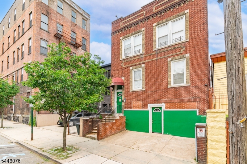 Excellent investment opportunity in the heart of Union City! This solid brick four-family offers 7 bedrooms and 4 full baths across 3,170 square feet, with a desirable unit mix: three 2-bedroom units and one 1-bedroom unit. Interiors have been tastefully updated and feature gleaming hardwood floors, renovated eat-in kitchens with granite countertops, wood cabinetry, and stainless steel appliances including dishwashers, plus updated tiled baths. Driveway parking adds rare off-street convenience. Classic brick construction with handsome corbeled detailing, low-maintenance exterior, and a prime location just minutes from Bergenline Avenue shopping and dining, schools, parks, and NYC transportation.