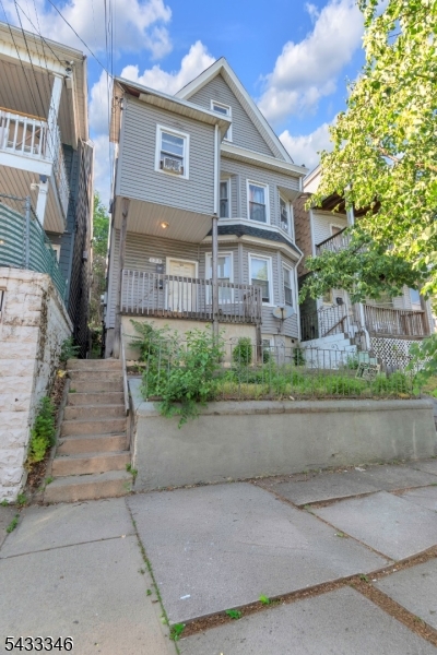 Spacious property in Paterson, NJ offering a strong investment opportunity or owner-occupant setup. Features a total of 7 bedrooms and 3 full bathrooms with generous layouts throughout. Includes a partially finished basement providing additional usable space, along with a finished attic that adds flexibility for storage or extended use. Enjoy a welcoming front porch and a functional layout that offers versatility and comfort. Conveniently located near public transportation, schools, shopping, and major highways making it attractive for convenience, rental potential, and long-term value.