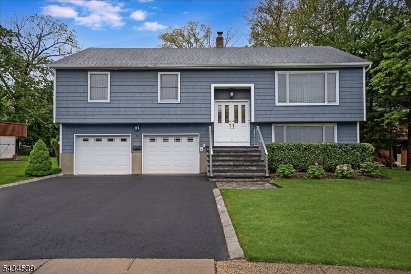 Spacious 4-bedroom, 2.5-bath bi-level home located on a quiet and safe cul-de-sac, perfect for comfortable everyday living. Conveniently situated within walking distance to bus stations with easy access to NYC and Newark Penn Station, Livingston High School, and just minutes from East Hanover shopping, restaurants, and everyday conveniences. The main level features a bright living room, a fully upgraded and renovated kitchen with sliding doors leading to a deck, that also includes a Combi-steamer oven, and spacious bedrooms with a full bath. The walkout lower level offers a large family room, dedicated office with closet and nearby bath ideal for guests or flexible living space, plus a laundry area and direct backyard access. Enjoy great indoor-outdoor flow, perfect for entertaining or relaxing.Major upgrades include Andersen windows throughout, central A/C, an energy-efficient heating system, and a newer hot water boiler (approx. 6 months old). Additional highlights include a 2-year-new whole-house power backup generator, a whole-house water softener system, and a drinking water filtration system for added comfort and convenience. The home also features security system wiring ready for setup and a Google smart doorbell. A 2-car garage and driveway parking add convenience, while public water and sewer make ownership easy. Most appliances are included. Move-in ready with space, functionality, and major system updates in a highly desirable location.