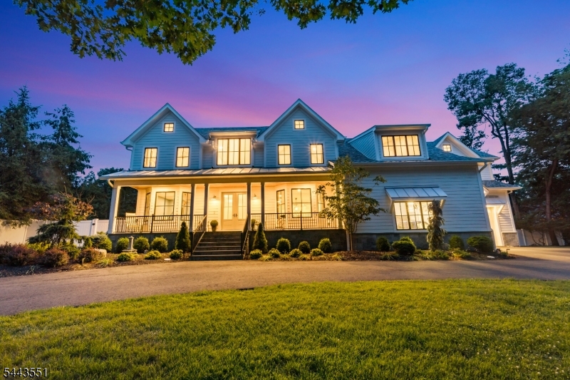 Built in 2023, this stunning custom Colonial Farm House offers approx. 8,674 sq.ft. of luxurious living space, including a 2,899 sq.ft. finished walk-out basement, on a beautifully landscaped one-acre property. Exceptional craftsmanship shines throughout, from the grand two-story foyer to the elegant living and dining rooms and expansive gourmet kitchen with a sunlit dinette, spacious family room, and fully equipped working pantry with its own refrigerator, sink, and dishwasher. The first floor also features a guest suite with a full bath and private backyard access, mudroom, and dual staircases. Sliding doors open to a covered patio with a fireplace overlooking an additional patio with pergola. Upstairs, the luxurious primary suite offers a fireplace, two walk-in closets, and a spa-like bath with a soaking tub, plus three additional ensuite bedrooms with walk-in closets and a finished bonus room. Radiant heated floors span every level, including the garages. The finished basement includes a guest bedroom, full bath, kitchen, office, abundant storage, backyard access, and direct garage entry. A reinforced storage room with 16-inch concrete walls and ceiling offers potential for a secure bunker. Completing the property is an extraordinary 1,874 sq. ft. garage with backyard access - ideal for multiple vehicles, Sprinter vans, an RV, boat, workshop, gym, sports court, or hobby space. A truly one-of-a-kind luxury home blending elegance, functionality, and endless possibilities.