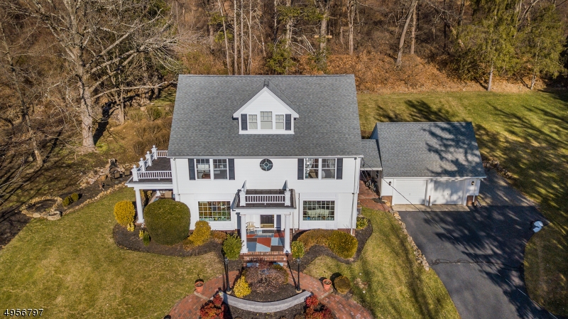 Easy "No Touch" showings.  Not your basic tract home, this one is custom!!  Beautifully polished w/quality touches & details, this colonial home features a circular drive leading to a covered front porch w/views of farms & fields.  DR leads to covered porch & outdoor kitchen.  Granite eat-in kitchen features stainless steel appliances, gas range & center island with breakfast bar, open to family room with built-in bookcases & French doors to breezeway/brick patio.  Two car garage offers a large loft storage area.  Four bedrooms & updated baths complement the 2nd floor.  A finished basement is perfect for crafts & games.  Newer furnace & hot water heater for peace of mind and central air for cooling comfort.  This home is minutes to the local farm stand, restaurants, shopping, movies, theaters & more.