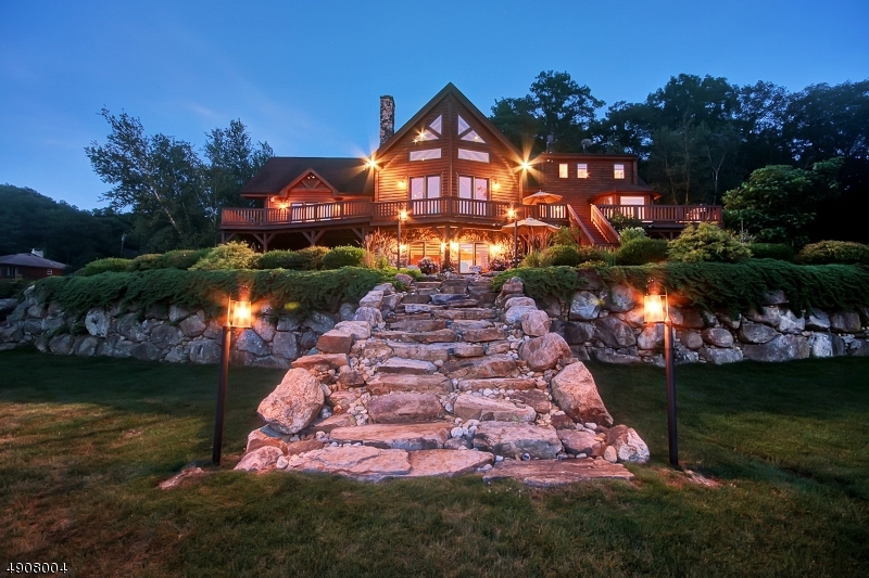 Privacy and relaxation await you less than one hour from Manhattan. This is the ultimate nature lovers paradise that offers complete privacy and endless entertainment throughout every season. Nestled on over 78 acres, this tranquil retreat overlooks your own personal 22 acre lake with sandy beach & features magnificent views out every window. This custom built over 5000 sq ft log-home boasts 4 bedrooms, 4.5 baths, great room with stone fireplace & vaulted ceiling, master suite, dining room, modern eat in kitchen, family room & gym. Additionally, there is a guest cottage with 3 bedrooms, full bath, living room, kitchen & 3 car garage. Meander throughout the miles of private hiking trails, enjoy swimming & paddle-boating right out your backdoor.This is truly a breathtaking property and one-of-kind home!