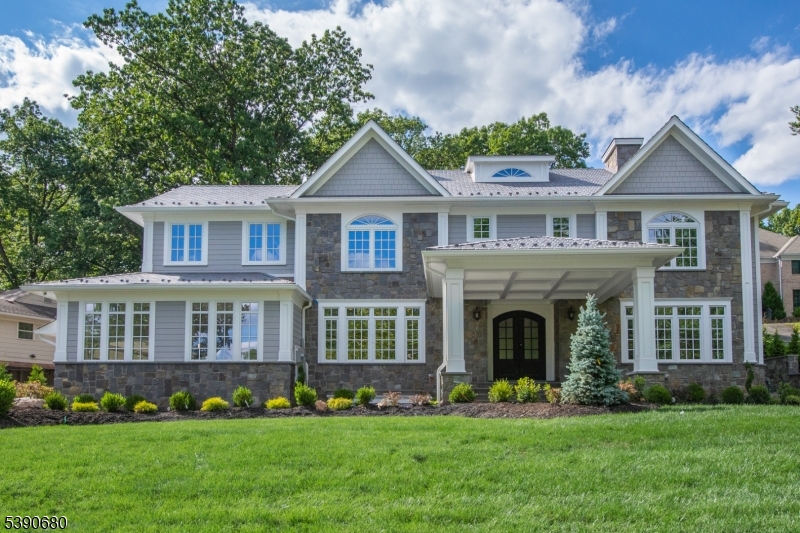 Spectacular Magazine Worthy New Construction 8 bedroom, 8.2 bath Luxury Home of over 8800 sq ft, ideally located on .67 acres on most prestigious street in Short Hills walking distance (.3 miles) to highly ranked Hartshorn Elementary School! Drive up the circular drive to enter the grand 2-story entrance hall with vaulted ceiling & marble floor, 9' high ceilings throughout the 1st level. Living room has gas fireplace, office has fireplace & coffered ceiling, massive dining room with butler's pantry, stunning gourmet eat-in kitchen with crisp white cabinetry, center island, top of the line stainless steel appliances, quartz countertops, totally open to family room with vaulted ceiling & wood-burning fireplace. 2 pairs of French doors open to massive bluestone patio with fire pit, vaulted covered area with a summer kitchen, wood-burning fireplace, plenty of room to entertain! Has 1st floor in-law suite, powder room, laundry room & easy access to attached 3-car garage. Luxurious primary bedroom has gas fireplace, 2 massive custom walk-in closets & 2 lavish spa-like baths with radiant heated floors. 4 more en suite bedrooms on the 2nd level. Beautifully finished walkout lower level with media room, rec room, exercise room, powder room, 2 bedrooms/office with windows & full bath. Potential wine cellar. Features include: High end Kolbe windows, Rheem 9 zone heating & AC, central vac, high end security, 300 amp electric service, generator ready & 10 year builder's warranty.