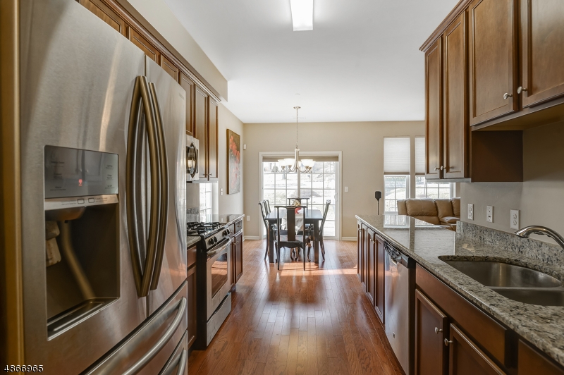 Absolutely pristine 2 bedroom, 3 bath End Unit Townhome!  Ideal commuter location!  Close to Morris Plains train station and all major highways.  Conveniently located to shopping, Morris Plains town center and Downtown Morristown.  Better than new condition!  Bight, open floor plan and tons of natural light!  First floor full bath is ADA compliant. Don't wait!  This one won't last!!!