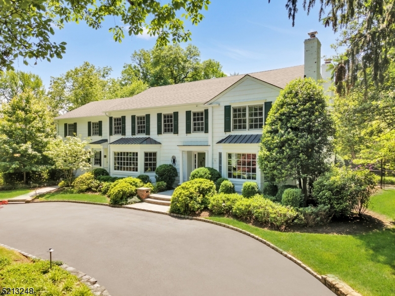 Located in the heart of Old Short Hills, this spectacular one-acre residence boasts tremendous curb appeal and every modern convenience. Elegantly refined, this home offers a classic floor plan and sophistication at every turn. Extensively renovated and expanded to exacting standards by David Rosen AIA, the heart of the home is a new open-concept kitchen complete with custom cabinetry, stone countertops, a large center island with walnut countertop, professional grade appliances, walk-in pantry and butler's pantry.  The kitchen flows seamlessly into an expansive breakfast room and family room with soaring ceilings. Walls of windows overlooking the park-like grounds offer breathtaking views, while a home office, library, 30' sunlit LR, formal DR, large mudroom and powder room complete the 1st floor. Upstairs, 5 bedrooms and 4 full baths provide a luxurious escape from daily life. The serene primary suite offers wonderful rear views while a second floor laundry center adds convenience. The lower level is an unexpected surprise, beautifully finished with 3 large recreation areas, exercise area, bar, wine cellar, full bath and extensive storage. One glimpse of the rear property with its expansive multi-level bluestone patios and alluring gunite pool will immediately end your home search. A large 3-car garage with loft storage completes this dream home. Ideally located in the Hartshorn school district and close to the NJ Transit Midtown Direct train line, this home is a rare find.
