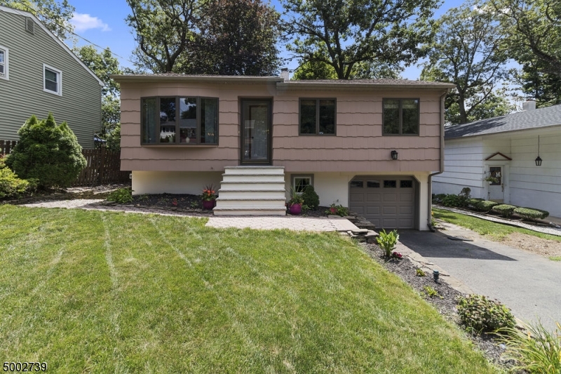 Fantastic raised ranch with 3 bedrooms, 1.1 bath on beautiful lot in Landing section of Roxbury.  Living Room with picture window & hardwood floors open to dining room with sliders to large deck, open kitchen, master bedroom, 2 additional bedrooms & main bath complete the first floor.  On the lower level is the family room with sliders to patio, 4th bedroom, powder room, laundry room and entrance to garage.  On the exterior is a spacious deck, backyard features a firepit area and lots of room for any activity.  Close to Lake Hopatcong, schools, shopping, highways & transportation.  Don't miss this one!  It's a keeper!