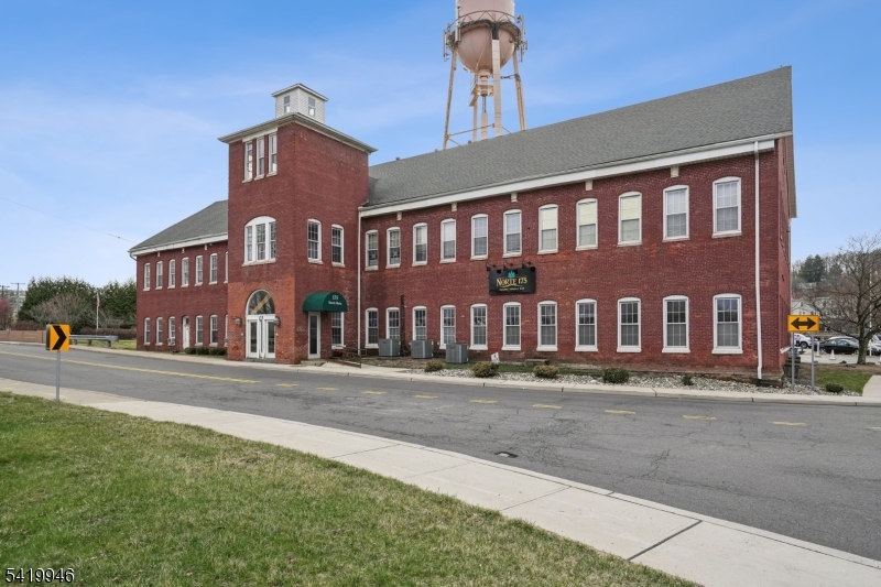 Great Investment & Opportunity to own approximately 20,000 square foot all Brick Building on 1.51 Acres that is mixed use with Offices and a Restaurant. Comes with a Liquor License being used by the Restaurant (Norte175). Restaurant Has Security & Sprinkler System. This once Silk Mill was built in 1885 sits on Washington Forge Pond with a Dam/Waterfall running along the side of the building with serene sounds and setting.  Office Spaces from 250 sq ft to 4500 sq ft.  Existing Tenants include Architects, Photography Studio, Art Studio, Engineering Group, Training Group, Psychologist, and a Religious Group.  Features 14 Foot Ceilings, 15" to 25" Column Spacing and charming Brick Walls. With a Use Variance Approval - 2nd Level Can be approved for Residential (Condos & Rentals). There is an possible Easement in discussion for the Decommissioned Water Tower Licensed for Cellular Antennas. Close to Rt 80, Rt. 46 & Rt. 15.  Close to Dover & Mt. Arlington Train Stations and NYC Buses.  There are 40 Surface Parking Spaces.  Unique Opportunity Awaits!