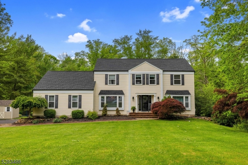Welcome to this stunning move-in ready colonial located in the highly sought-after Glen Ridge Estates. This home features an open floor plan with generously sized rooms and an updated kitchen with granite countertops, a tile backsplash, and stainless steel appliances. The family room, complete with a wood-burning fireplace, opens through French doors to a multi-level Trex deck with a vinyl pergola and retractable awnings. The private backyard is perfect for relaxation and entertainment, offering a heated in-ground pool, patio, hot tub, and two sheds for additional storage. The finished walk-out basement is an ideal space for entertaining and provides ample storage (has separate electric heat). Recent updates include a brand new front door, a new roof, a new well pump and boiler in 2018, a new pool heater and garage doors in 2017, a new hot water heater and air conditioning system in 2016, and a newer septic system from 2010. Additional features include an ADT Security System and a Canine Electric Fence. Located within the highly rated Washington Twp & West Morris School Districts, this home is a must-see!