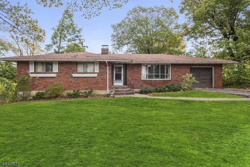 Brick Ranch with an attached garage & lots of curb appeal sits on .45 acres of well-manicured property. A bright entryway welcomes you to this cheerful sun-soaked 4 bedroom, 3 bath home..Entertain guests in the large & inviting living room w gorgeous bay window, or host dinner in the formal dining room. Meal preparation is a breeze in the cheerful kitchen complete with plenty of cabinetry & sleek countertops. Three sunny bedrooms each have ample closet space, & a full bath is across the hall. A convenient laundry room w an attached bath is on the main floor. The fully finished walk-out lower level has a large family room w a brick wood-burning fireplace, plus a fourth bedroom. The office can also serve as a playroom or hobby room, & a full bath & storage/utility space complete this level.