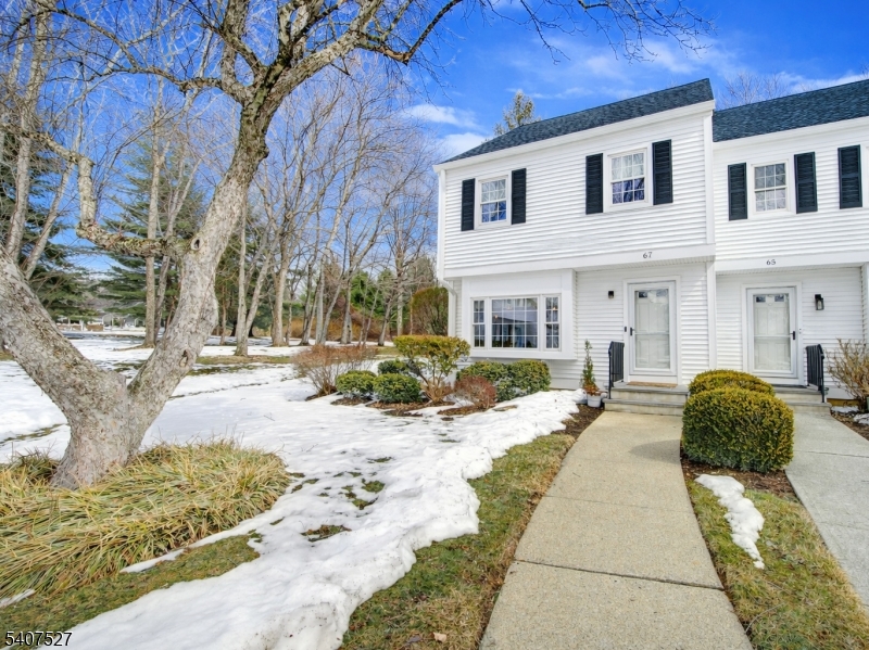 Highly desirable Mendham Commons, is known for its exceptional amenities and prime location. This sun-filled home offers two spacious bedrooms and one-and-a-half baths, thoughtfully renovated and upgraded throughout. The modern kitchen features updated cabinetry, a center island, stainless steel hood, quality appliances,and a dining area with sliders leading to the private patio. Upstairs, the large, fully renovated bath connects to both bedrooms and showcases contemporary finishes and comfort. The convenience of second-floor laundry enhances everyday living, while both bedrooms offer generous space and natural light. As an end unit, this home enjoys added privacy and extra windows, creating a bright and airy atmosphere. The full basement provides laundry, storage, and excellent potential for additional living space. Residents of Mendham Commons enjoy beautifully maintained grounds and a wide range of amenities, including both indoor and outdoor swimming pools, tennis courts, a clubhouse, and walking paths. The community is ideally located close to shopping, dining, and just 7 miles from Morristown. Public utilities are included, and the association has recently replaced the roof. Additional features include wood floors, recessed lighting, and a neutral palette throughout. This move-in-ready townhouse offers the perfect blend of comfort, style, and convenience. 2 assigned parking spots  - roof & siding have been recently replaced