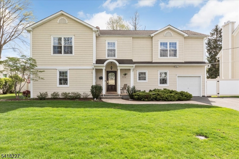 Beautifully maintained and thoughtfully updated, this 5-bedroom, 2.1-bath Colonial offers exceptional space, flexibility, and comfort on a quiet, tree-lined street in one of Westfield's most desirable residential neighborhoods. Ideally located just minutes from downtown, top-rated schools, parks, and transportation. The first level offers outstanding versatility with two bedrooms, ideal for guests, home offices, or additional living space. The main living areas include a tastefully updated eat-in kitchen, formal dining room, and a bright, inviting living room with a gas fireplace. A charming sun porch opens to a private backyard featuring a patio and fountain, creating a serene setting for outdoor enjoyment. A full basement provides excellent storage and potential for future finishing. The second level features three additional bedrooms, including a spacious primary suite with exercise room/office/sitting room and walk-in closet, as well as a convenient second-floor laundry. A lockable elevator provides secure, seamless access between levels, enhancing ease of living, while a whole-house generator provides added peace of mind and year-round reliability.Truly turnkey and move-in ready.