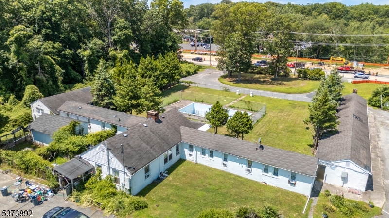 Attention Builders, Developers & Investors! Rare opportunity to acquire a highly visible 2.2-acre commercial property on busy Route 66 in Neptune, surrounded by major redevelopment projects and located just minutes from Jersey Shore beaches, Jersey Shore Premium Outlets, and national retailers. This prime C-1 zoned site offers exceptional exposure and allows for nearly 200 permitted uses. The existing 25-room motel with in-ground pool and circular driveway requires complete renovation, however, its strategic location historically generated strong summer occupancy at peak season. The expired OYO franchise agreement provides a blank slate?rehab, rebrand, repurpose, or tear down and build new. Whether you're envisioning a hotel, retail center, medical office, restaurant, mixed-use concept, or a stand-alone commercial building, the possibilities are endless. Value is in the land and unparalleled location. Property is strictly sold AS-IS. Cash buyers only with quick closing preferred. Showings by confirmed appointment only.