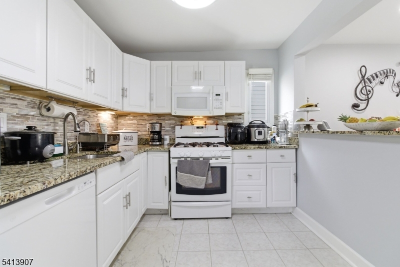 Welcome to one of the most compelling investment opportunities on the market today. This fully renovated single-family home ? updated in 2024 ? has been thoughtfully configured to maximize both comfort and cash flow.The flexible floor plan boasts 5 spacious bedrooms, 2 full kitchens, and 3 separate living areas, forming three self-contained units under one roof. The primary unit features 3 bedrooms, making it ideal for an owner-occupant looking to live in one unit while the remaining two generate strong supplemental income.