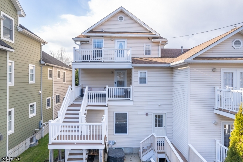 Unparalleled location! This updated 3 bedroom condo is just steps to both the train and Morristown's vibrant downtown. One enters this bright and spacious two-story condo through your own private entrance into the mudroom. The main level offers a kitchen with stainless appliances and granite countertops that opens to the living and dining space. The level is complete with a powder room, stackable washer/dryer and doorway to a stairwell that leads to the front of the building. Upstairs are three bedrooms and a full bath. The generous primary suite offers a bonus space with custom tray ceiling that could be used as a home office, nursery, or sitting room. There is hardwood flooring throughout and incredible natural light. Outside offers a spacious deck off the main level, a private balcony for the rear-facing bedroom and space for a grill. There is off-street parking for two cars in the back of the building as well as permitted on-street guest parking. There is a large basement storage space as well. Don't miss your chance to make this your home in the heart of Morristown.