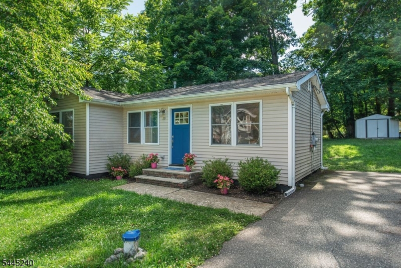 This beautiful move-in ready home is the perfect alternative to condo living or renting. Home sits on 1/4 acre private lot suitable of future expansion. The home offers a large private backyard with deck and enough room for grilling and fire pit (all outdoor furnishing stay with the home). One Floor open concept that is ideal for entertaining and everyday living. Updates include luxury vinyl hardwood flooring throughout, updated kitchen with Bosch refrigerator, soft-close cabinets with custom pull out lazy-Susan, brick accent wall and ample counter space, premium lighting fixtures throughout, tilt in windows and updated full bathroom .Primary bedroom is spacious with a beautiful view of the rear yard. Versatile second bedroom can be used as a den, home office, studio space, or baby suite. Interior conveniences include; cozy electric fireplace, central air, ceiling fans in bedrooms, closet organizers, pantry, professionally waterproofed encapsulated crawl space provides clean, dry storage area the entire length of home plus easy access to furnace and plumbing, well pump has been replaced, electrical upgrade 200AMP and whole home generator included. Exterior conveniences include; storage shed, professionally installed electric fence.  Low property taxes & coming soon convert to natural gas at no cost to connect, incentives and rebates on appliances.