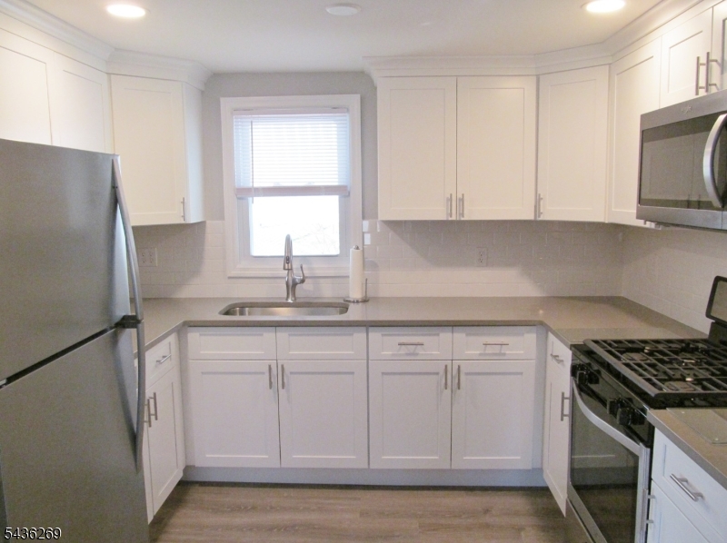 Great Investment opportunity in this well maintained 2 family with detached 2.5 car garage located in one of Raritan's best neighborhoods!  Or live in one side and keep the other side rented to help offset your mortgage... Completely renovated (2022) second floor (unit 2).  All renovations done with approved town permits. Lead safe certificates in place. Big level fenced-in backyard with screened-in patio, open air patio, nice landscaping, and relaxing sunset views. Unit 1 on the first floor features a large living room, spacious eat-in kitchen with lots of cabinets and counter top space, two bedrooms, beautiful hardwood floors, full bath, large finished basement with separate laundry/utility room, enclosed side porch with entry to the driveway and yards, and private off-street driveway parking. Unit 2 features a beautiful new kitchen with stone counter tops, stainless steel appliances, and recessed lighting, gorgeous new full bath, living room, spacious bedroom with ceiling fan and brand new closet, new stylish laminate flooring, fresh paint, window AC units and private off-street driveway parking. Commuter's delight - close to Raritan Train Station with NYC service, Park and Ride Bus Service, & major highways. Only a few minute walk to downtown Raritan's shops and restaurants, and recreational opportunities at nearby Duke Island Park. A five minute drive to popular downtown Somerville's dining, shopping and events, and the Bridgewater Commons Mall. More pictures coming soon