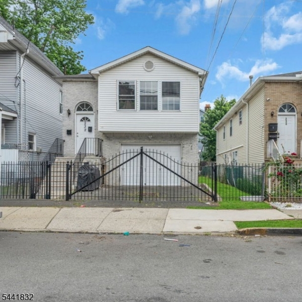 Welcome to 232 4th Ave, a well-maintained two-family home offering the opportunity to enjoy homeownership while generating rental income from day one. The upper-level owner's unit was just renovated and features 3 bedrooms, 2 full bathrooms, including a private primary suite, a dedicated laundry room, hardwood floors, and a beautifully updated kitchen with quartz countertops, shaker cabinetry, and stainless-steel appliances. The ground-floor 3-bedroom, 1-bath unit is currently occupied and generating $2,450 per month in rental income. Outside, enjoy a private driveway, built-in garage, fenced backyard, and attractive curb appeal. Conveniently located near Branch Brook Park, shopping, public transportation, and major highways, this is an excellent opportunity for today's owner-occupant or investor looking to build long-term wealth through real estate.