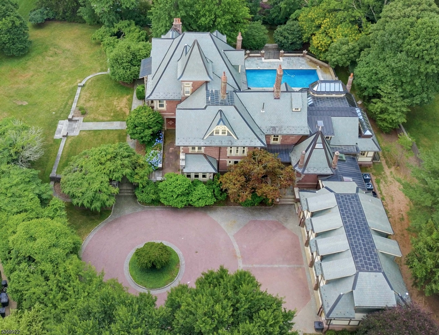 One of the Most Spectacular Homes in Short Hills! Mint condition with rooms of grand proportions, high ceilings & period details throughout and every amenity! Ideally located on 1.44 totally level acres w/ specimen trees, new pool with spa & electronic cover, new bluestone patio. Stunning new gourmet eat in kitchen with center island & top of the line appliances open to family room & new sunroom w/ soaring ceilings. Great office w/ built ins opens to sun porch overlooking property. Easy first floor access to attached 4 car garage. Luxurious Master bedroom w/ 2 spa like master baths & walk in closet. Back stairs lead to in law suite. Beautifully finished lower level w/ Media room, recreation room, Nanny's suite w/ kitchenette & walkout access. Ideally located on a quiet street! Bus service available.