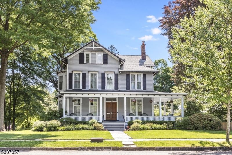 You've been waiting for this one! Blending Victorian details&charm w/modern comforts, this exceptional home retains many original architectural features while offering thoughtful updates throughout. From the moment you enter, you'll be captivated by the grand foyer w/inlaid wood flooring, original molding & two stunning wood-burning fireplaces w/their original mantels perfect for cozy evenings in both the living and dining rooms. Sunlight pours in through picturesque bay windows, highlighting the home's rich character&craftsmanship. The kitchen has been renovated&footprint expanded, featuring white cabinetry&access to the back porch overlooking the gorgeous yard&pool. All of the home's bathrooms have been renovated. With six spacious bedrooms plus a bonus room ideal for a home office, there's plenty of room to live, work&grow. Situated on a fully fenced corner lot, the home is surrounded by professionally landscaped gardens, creating a private backyard oasis complete with a heated in-ground pool, wrap-around front porch&multiple outdoor living spaces perfect for entertaining or relaxing year-round. Additional highlights include CAC, abundant storage and seasonal NYC skyline views. Unmatched convenience w/jitney stop right at your front door. Whether you're sipping morning coffee on the porch, hosting summer pool parties, or watching the garden come to life through the seasons, this home is designed for making lasting memories. A true gem on one of GR's most iconic streets.