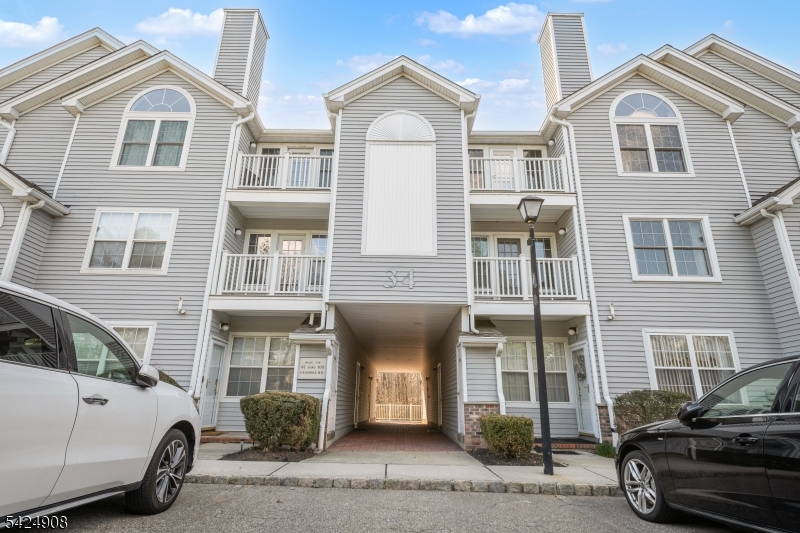 This beautifully maintained 3-bedroom, 2-bath condo offers comfort and style throughout, featuring private balconies off both the third and primary bedrooms. The spacious living room showcases stunning cathedral ceilings, recessed lighting, and a cozy wood-burning fireplace. Enjoy the convenience of an in-unit washer and dryer, while the primary suite includes a walk-in closet and a private en-suite bath. Residents have access to a vibrant clubhouse with premium amenities, including an in-ground pool, tennis and pickleball courts, private party hosting area, and an outdoor track. Don't miss your chance to own in this highly desirable community!
