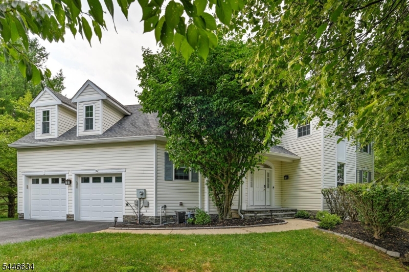 Move-in ready and beautifully updated, this 5-bedroom, 3.1 bath home is located on a quiet cul-de-sac and features a desirable northeast-facing front door. A dramatic two-story foyer welcomes you to an open floor plan with oak hardwood floors throughout the first and second levels. The main floor offers a private office, formal living and dining rooms, a spacious family room with a wood burning fireplace, an updated eat-in kitchen with granite countertops and stainless steel appliances, and a convenient laundry room. The dining and family rooms open to a wraparound deck with a gazebo, perfect for entertaining. Upstairs features an expansive primary suite with an updated bath, walk-in closet, bonus room, three additional generously sized bedrooms, and a renovated hall bath. The fully finished walk-out basement includes luxury vinyl flooring, a kitchenette with quartz countertops and dishwasher, recreation space, full bath, and access to a patio overlooking a peaceful backyard. A perfect blend of comfort, style, and functionality!