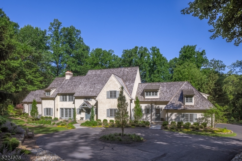 Stunning! This extraordinary English country manor home, updated to perfection in 2023, boasts exquisite finishes and luxurious amenities that will leave you breathless. With its secluded location at the end of a private road on over 6 acres of lush land, this 6-bedroom residence epitomizes sophistication and style. As you step inside, you'll be captivated by the open flow of rooms and the light tones that create an ambiance of modern elegance. The newly renovated kitchen and bathrooms showcase the latest in design and functionality, ensuring that every detail has been carefully considered. The beautiful cement stucco exterior, complemented by a hand-split cedar roof, seamlessly blends with the well-appointed interior to create the ultimate indoor-outdoor experience.Outdoor entertainment is a breeze in this remarkable home. The expansive terrace, complete with a fireplace, provides the perfect setting for gatherings with friends. The finished walkout lower level offers additional space for recreation and relaxation, while the free-form pool and meticulously manicured gardens create a picturesque backdrop for outdoor enjoyment.Beyond the tranquility of this private oasis, you'll find an array of amenities and activities to enhance your lifestyle. The surrounding area boasts an abundance of shopping, dining, and recreational opportunities as well as equestrian facilities, nationally-ranked golf courses, and excellent schools. Highways and NJ Transit are in close proximity.