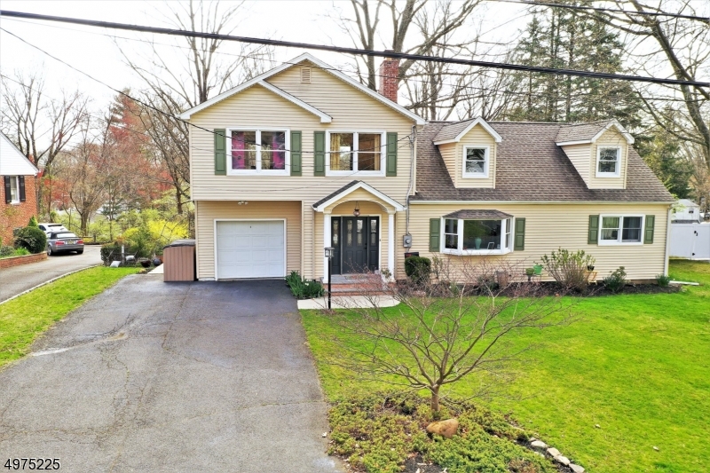 6 beds 3 full baths. Multiple updates since ownership! Updated Eat-In Kitchen SS appliances, custom made cabinets w/ window overlooking the yard. Oak hardwood floors. 2 beds on the 1st fl. 4 beds upstairs. 1 bedroom addition has been turned into a completely private sound proof studio w/ one full bath offering privacy and tranquility. Oversized deck overlooking 0.27 acres. Cozy finished basement with gas burning fireplace. Walking distance to top rated schools and Close proximity to NJ Transit. Don't wait make an offer TODAY!