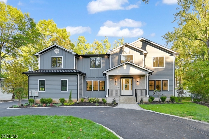 Stunning NEW CONSTRUCTION in the coveted Deerfield section, set on a flat, fully fenced 0.46-acre lot. Spanning approx. 7,500 sq ft inc garage across 3 finished levels, this home features 7 bedrooms, 6.5 baths, oversized 2-car garage & a circular driveway. A dramatic 2-story foyer opens to sun-filled interiors with 10 ft ceilings on the first and second floors and 9 ft ceilings in the finished basement.The family room w/ fireplace & built-in speakers flows seamlessly into a gourmet chef's kitchen w/ an oversized island, custom cabinetry & hood, Sub-Zero & Wolf appliances, double wall ovens, walk-in pantry, & breakfast nook. Formal living & dining rooms plus a sophisticated bar area create an ideal setting for entertaining, while a first-floor en-suite, mudroom, & powder room add everyday convenience.Upstairs, the primary suite offers dual walk-in closets & a spa-like bath w/ soaking tub, dual vanities & oversized shower. Four additional bedrooms include two en-suites w/ walk-in closets & two connected by a Jack-and-Jill bath, along w/ a full laundry room. The finished basement features a media room, recreation space w/ built-in speakers, office, fitness studio, guest suite, full bath & storage.Smart features include Nest thermostats, Ring doorbell, & EV charger, while a spacious patio overlooks the fenced backyard. Conveniently located near Gero Park, golf courses, town pool, top-rated schools, shopping, & NYC transit, and backed by a 10-year builder warranty.