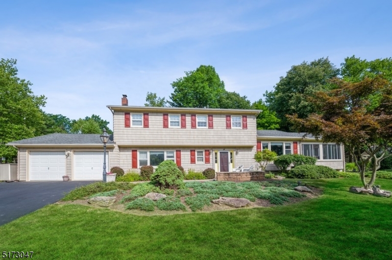 Spacious design & sprawling property. Light-filled custom Colonial is nestled on a landscaped corner lot in the enviable Franklin Farms neighborhood of Mendham. With its small-town feel, sought-after schools & ready access to nature, this location is close to shops, eateries, parks & Rt 287. Along w/an attached 2-car garage, this expansive prop includes a patio, a large deck, a backyard storage shed, a fenced-in vegetable/herb garden & an enchanting koi pond. Inside, the tiled foyer with a powder room reveals an open floor plan perfect for entertaining with hardwood floors, crown molding & trim details & tranquil views from every window. A few steps up from the sitting rm is a large LR w/double glass doors to a beautiful sunroom featuring a vaulted ceiling & views of the pond and lush, green grounds. The comfortable FR has a cozy wood-burning stove. The layout continues to the spacious eat-in kitchen w/granite countertops, tile backsplash, a walk-in pantry, a generous breakfast bar & a skylight in the raised ceiling bringing in lots of natural light. The adjacent breakfast area faces a wall of windows & glass sliders opening to the deck & patio. Also on the main level is a BD w/a full en suite BTH, a laundry rm & garage access. The 2nd floor comprises the primary BD suite w/a WIC and en suite BTH, 3 additional BDs & a full hallway BTH. Invisible dog fence included!
