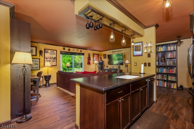 Beautiful fully updated 1st floor condo in the heart of Franklin Township, Somerset. A quiet and tranquil community, easy walking, biking, driving distance to many eateries, and parks. Amazing running and biking paths. Condo is backed up to a nature preserve boasting many, many acres of protected woods and also, the Quailbrook Golf Course. All appliance are relatively new, within the last two-three years. New refrigerator, oven/range, dishwasher, microwave, hot water heater, washer/dryer combo, all new kitchen cabinets, Corian countertops, tile backsplash, new porcelain tile (wood grain look) throughout, all new lights fixtures, new tile floor in the full bathroom, new cabinets and sink in the newly renovated bathroom, new walk-in shower, tile wall, glass sliding doors. All new windows replaced throughout the condo this past December. Crown Molding throughout the main living area. Meticulously Maintained.