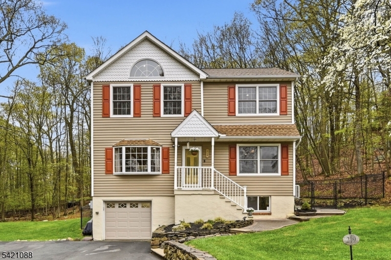 Set in the highlands and surrounded by natural beauty and nearby state parks, this exceptional property offers a true retreat. Enjoy stargazing under a velvet sky or step right from your private backyard onto scenic hiking trails with breathtaking views. Conveniently located just minutes from ski resorts, sailing, fishing, hunting, and sightseeing, it offers year-round recreation for every lifestyle. This beautifully updated Colonial welcomes you with the soothing sounds of a private brook and sits on over 1 acre of professionally landscaped grounds. Inside, you'll find elegant crown molding, hardwood floors, and soaring cathedral ceilings enhanced by abundant natural light from skylights. The home features 3 bedrooms, 2 full baths, a finished basement, and an enclosed patio perfect for relaxing or entertaining. Additional highlights include an oversized garage, a tool shed, and many more thoughtful upgrades throughout. Be sure to experience the full 3D Virtual Tour & review the comprehensive Documents section, including the Seller's Disclosure. All offers must be accompanied by pre-approval letter or proof of funds. Schedule your private showing today homes of this caliber rarely last! *Property is taxed in Bloomingdale; however, uses all of Wanaque services [i.e. school, USPS, utilities, driver's license, etc.]* NOTE: Road will be paved on May 8, 2026.