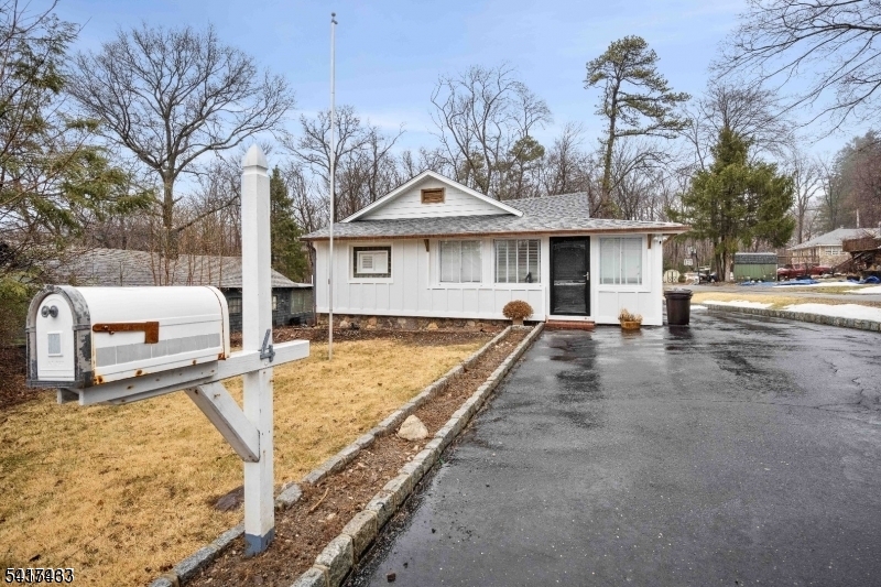 Vacation year around in this renovated two bedroom, two and a half bath home in one of New Jersey's most sought-after private lake communities!  This cottage has been completely renovated in 2019 with many upgrades including a new roof, new composite decking, genuine copper gutters and clapboard siding on the exterior.  Inside, you will find every room has been customized to maximize space with two extra bonus rooms, new plumbing, updated electrical system, new half bathroom, water treatment system, flooring, etc. This home has lake views with only a short stroll down to Green Pond Lake - NJ's cleanest lake.  This community offers boating, fishing, beaches, tennis/basketball, playgrounds and club house.   Dock space also available for purchase. Do not miss the opportunity to make this cottage a perfect place to call home after a fun day on the lake!