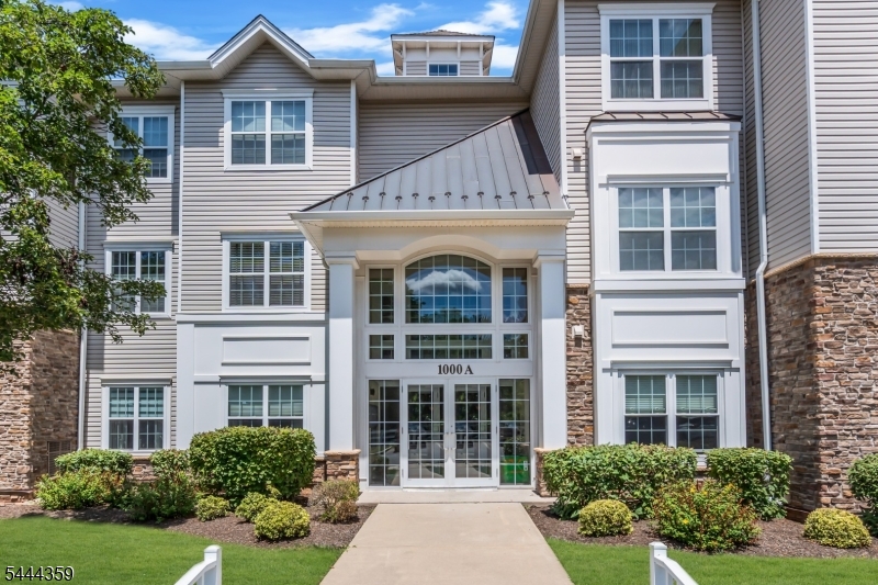 Welcome to this move-in ready TOP-FLOOR END UNIT condo, the largest condominium floor plan in Somerset Run (SSR). A rare offering, as end units are limited in SSR. Offering approx. 1900 SF, this spacious residence features 2 bedrooms, 2 full baths, formal living and dining rooms, an eat-in kitchen, den/flex room, laundry room, and a private covered balcony. Additional highlights include 2 underground parking spaces, elevator, intercom entry system, and a private storage room conveniently located on the same floor. Beautiful bamboo HWF flows throughout the main living areas, with carpeting in the bedrooms and den. Interior details include crown molding, 9' ceilings, recessed lighting, and a box-tray ceiling in the primary suite. The spacious primary bedroom offers a WIC and ensuite bath with a glass-enclosed Lasco shower with built-in seat, cultured marble vanity, and oversized mirror. The eat-in kitchen is appointed with 42" oak cabinetry with raised panel doors and roll-out shelving, Corian countertops, ceramic tile flooring, and a large pantry. Water and garbage are included in your HOA. New HVAC 2024 & water heater 2019. Enjoy Somerset Run's resort-style lifestyle in a 24-hour gated 55+ community featuring a 25,000 SF clubhouse, indoor and outdoor pools, fitness center, tennis, pickleball, bocce, sauna, card rooms, ballroom, clubs, and social activities. Conveniently located near Route 287, shopping, hospitals, and public transportation, with NYC approx. 1 hour away.