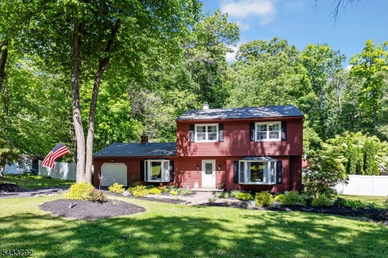 Welcome to this picturesque colonial on a cul-de-sac in Long Valley's desirable Fawnridge neighborhood. This inviting home offers public water and sewer, natural gas, and central air-conditioning on a flat, fenced yard with a shed. The beautifully renovated (2023) eat-in kitchen features custom cabinetry, granite countertops, and a farmhouse sink, with easy access to both the screened porch and adjacent dining room. Thoughtful details like window seats in the living and family rooms and wood flooring throughout much of the home add charm. The family room includes a fireplace while a screened-in porch provides the perfect space for entertaining and opens to the patio and lovely private backyard. A first-floor laundry room and powder room add convenience. Upstairs offers four comfortable bedrooms and well-designed hall bathroom. The finished partial basement provides additional living space along with storage. The home also features an attached one-car garage and many new updates since 2020: fence, carpeting, washing machine, ceiling fans and light fixtures, landscaping, front porch, shutters, hot water heater, kitchen appliances (stove, microwave, and dishwasher), and generator interlock hookup. Located in the IB West Morris Central school district, this home is just minutes from town, farms, restaurants, and major highways combining comfort, updates, and a prime location.