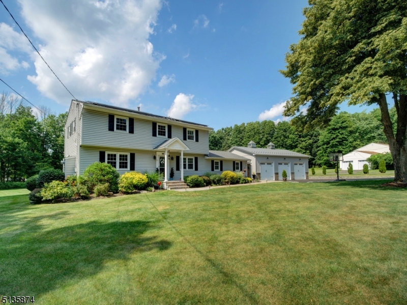WELCOME HOME TO THIS BEAUTIFUL 4 BEDROOM, 2.5 BATH COLONIAL ON OVER 1.5 ACRES. THIS HOME HAS MANY RENOVATIONS & UPGRADES INCLUDING: NEW WOOD FLOORING THROUGHOUT, NEW 3 CAR EXPANDED & INSULATED GARAGE (WITH 9' X 9' OVERSIZED DOORS) WITH SEALED CONCRETE FLOORING,  UPDATED KITCHEN WITH BREAKFAST BAR, GRANITE COUNTERTOPS, TILED BACKSPLASH & STAINLESS STEEL APPLIANCES.  NEW, EXPANDED POWDER ROOM AND NEW FULL BATH ON 2ND FLOOR.  OTHER FINISHING TOUCHES INCLUDE CROWN MOLDING, COFFERED CEILING AND PICTURE MOLDING IN DINING ROOM, RECESSED LIGHTING THROUGHOUT FIRST FLOOR & A NEW, GORGEOUS GAS FIREPLACE IN LIVING ROOM.  A BRAND NEW FAMILY ROOM WITH HIGH-EFFICIENCY MINI SPLIT HEAT/ AC ADDED IN 2021. ENJOY A BBQ ON THE ENTERTAINING-SIZED DECK AND A SWIM IN THE ABOVE GROUND, NEWLY-LINED CHLORINE POOL. BRAND NEW DRIVEWAY IS OVERSIZED, 3-CAR WIDTH AND LINED WITH PAVER WALKWAY. WHOLE HOUSE GENERATOR INCLUDED FOR PEACE OF MIND.  SOLAR PANELS ARE LEASED TO BUY WITH 14 YEARS LEFT ON CONTRACT AND PAYS FOR ITSELF (SEE ALL DOCUMENTS IN MEDIA SECTION).  NEW HOT WATER TANK.  SUPER CLOSE TO ALL MAJOR HIGHWAYS.  PUBLIC UTILITIES HERE!  THIS ONE WON'T LAST!