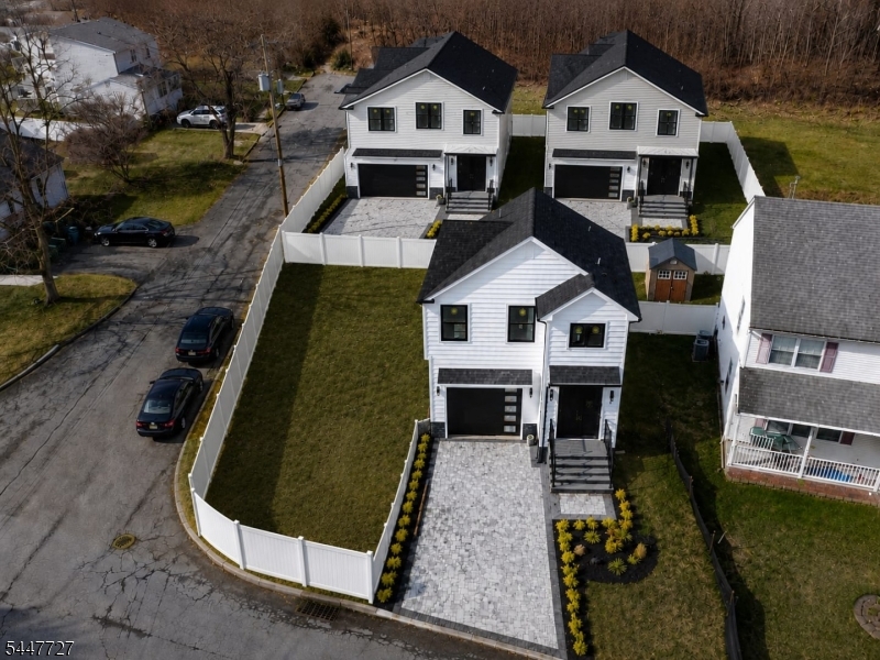 Welcome to 95 Kennedy Ave -- a beautiful newly constructed home offering modern style, functional design, and quality finishes throughout. 5 min drive to Aberdeen-Matawan train station. Easy commute to NYC Penn Station. Free parking at the station. Featuring an open layout perfect for today's lifestyle, spacious rooms, contemporary kitchen and baths, and plenty of natural light.Custom flooring throughout, and two-zone heating and cooling. Outside, enjoy the pavers, quiet backyard andrear access leads to the crawlspace basement. Construction of more new houses begins in the back.