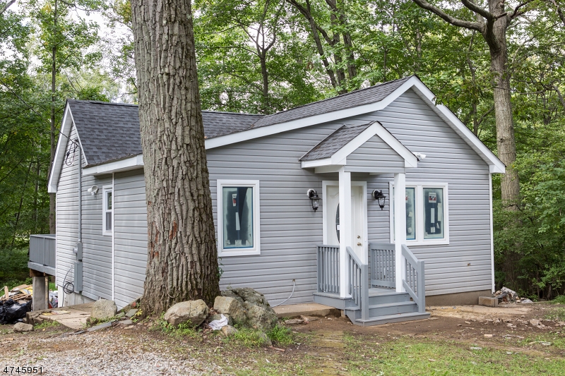 Beautifully renovated 2 bedroom 1 bath ranch. Home boasts new flooring, siding, windows, roof, heating, AC