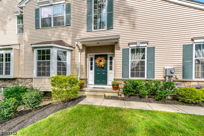 Magnificent Carlyle End-Unit home situated on a premium wooded lot.  Home features an expanded family room with a gas fireplace, hardwood floors, two-story foyer, living room with vaulted ceiling and bay window, spacious master bedroom with cathedral ceiling, walk-in closet, and ensuite bathroom. The second-floor den serves as a guest bedroom. Finished walk-out basement with and additional halve bathroom. Upgraded 42 " Maple kitchen cabinets, granite, breakfast bar, and back-splash. The extended deck has views of the woods. Concrete patio off the basement slider doors.  Morris Chase offers many amenities which include pool, clubhouse, gym, tennis courts and playground.  Conveniently situated to major highways, shopping, and NYC transit.