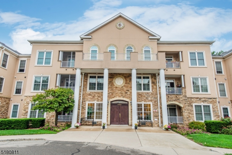 2nd Floor Unit, Covered Garage Parking with Storage, Screened Porch, Excellent Location to Major Highways