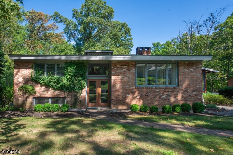 Bright & Sunny Bi-Level with a Contemporary, Mid-Century Flair!! Located on a quiet street in the desirable Glacier Hills community. Lovingly cared by the same Owners for 55 YEARS. Lots of Generous Room Sizes to Spread Out & Make Your Own! Tons of natural light -large windows throughout living space. Open LR with double sided WB fireplace, formal DR & Eat-in Kitchen. Screened-in porch. 2 generous sized BDRMs & full bath upstairs. family room, Den & Flex room on lower level. Two additional fireplaces. 3rd BDRM, half kitchen & bath/mudroom completes this floor. Enclosed porch. Plenty of storage! The backyard is level & private. Large deck. An ideal spot to relax & enjoy life. DREAM HOME potential! Minutes to all the community has to offer; with membership -enjoy the pool, walking trails, playground, events, etc. Convenient to NYC-Direct mass transit. Great Parsippany Schools.