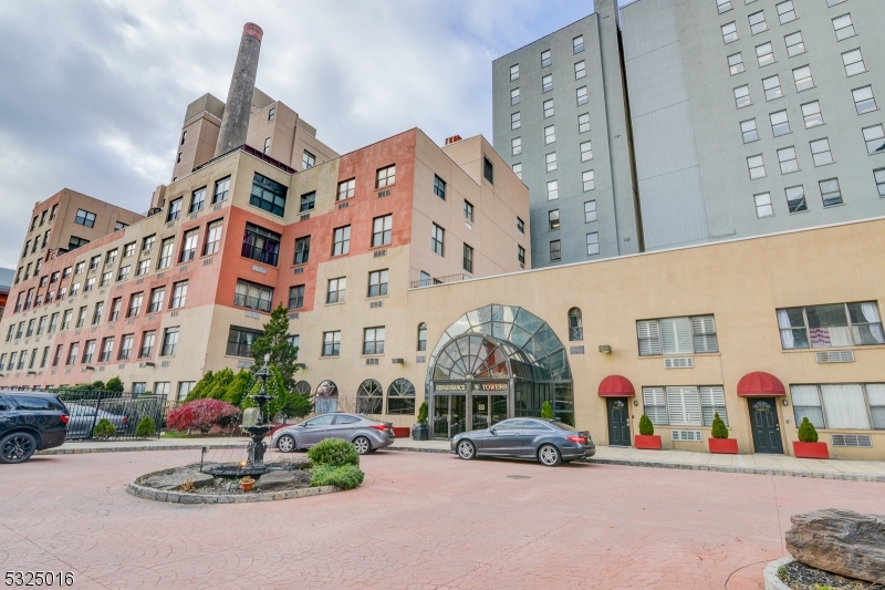 Enjoy Convenient & Easy Living In The Heart Of Downtown Newark! This Renovated 2 Bedroom/1 Bath Apartment Has Been Tastefully Designed For Today's Renter. Enter Into This 2nd Floor Unit And You're Immediately Welcomed By The Polished Concrete Floors And Open Layout. The Modern Kitchen Offers Stainless Steel Appliances, Quartz Countertops, Gold Finishes AND A Wine Fridge! Generous Storage Space Throughout, Wired Speaker System, Apple T.V. AND W/D Inside The Unit. Underground Parking & Monthly Cleaning Service Are Included. Just A Stone Throw Away From Newark Penn Station (15 Mins to NYC), Prudential Center, Seton Hall Law, Whole Foods And NJPAC. Building Amenities Include 24/7 Concierge, Gym, Sauna And A Recreation Room For Entertaining. JUST MOVE RIGHT IN!