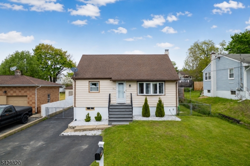 Opportunity knocks on this classic Cape Cod on a peaceful cul-de-sac! Bright living room with hardwood floors & bow window. Updated kitchen with ceramic tile & separate dining area. Two main-floor bedrooms + full bath. Oversized upper-level bedroom   perfect for an office or retreat. Full walkout basement with workshop potential. Massive 2-car detached garage. Central A/C, public water & sewer. Walk to town   commuter friendly. AS-IS sale. Don't miss this one!