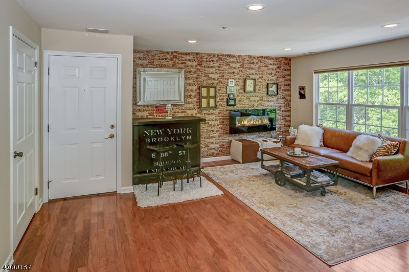 This Bright, updated condo has views of the woods with the feel of a loft in NYC. Spacious two story condo located in desirable Eden Lane in Hanover Township. This well maintained home features a open floor plan with a bright living room and dining room combo. The kitchen has lots of cabinets, the den (could be used as second bedroom) & the laundry is conveniently located off of the kitchen. Powder room has a storage closet for extra storage. Staircase with cathedral ceilings leads to a master suite with a full bath & walk-in closet. Large bedroom with southern exposure. Large, private storage area on ground level. Enjoy summers  at the Eden Lane pool  Easy access into downtown Morristown and Convent train station. Walk to NYCbus.